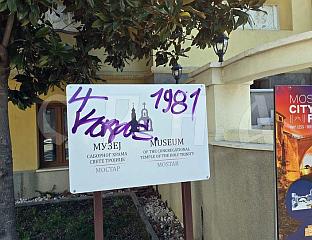 GRAFFITI ON SIGN IN FRONT OF BISHOP'S COURT HOUSING SERB INSTITUTIONS