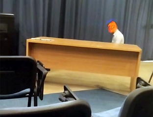 MAN PERFORMS ISLAMIC PRAYER IN JOURNALISTS' WORKSPACE