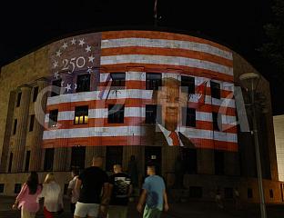 PALACE OF THE REPUBLIC ILLUMINATED IN COLORS OF THE US FLAG